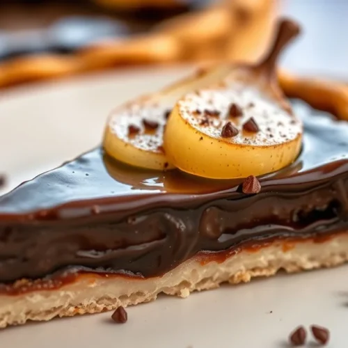 Slice of delicious chocolate pear tart with glossy dark chocolate filling, fresh pear halves, golden pastry crust, artfully p